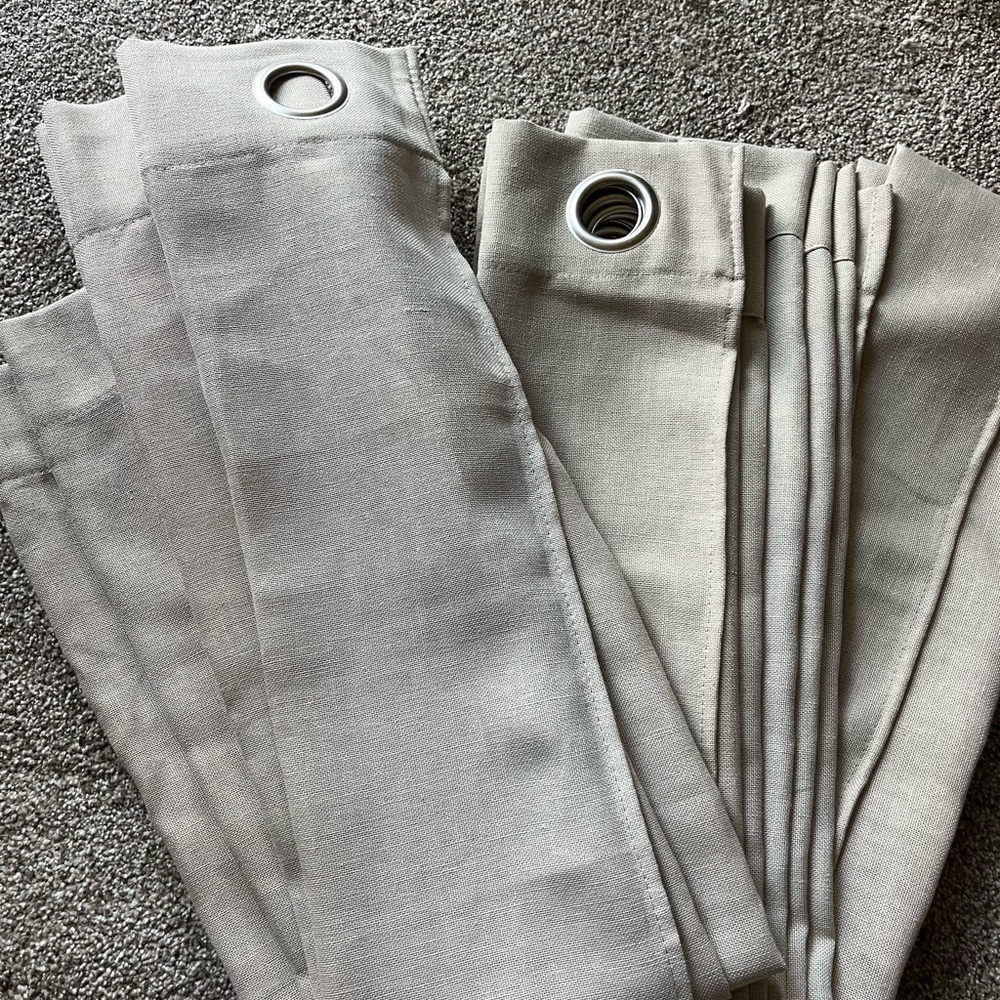 Two curtain panels approximately 54 inches wide by 94 inches long tannish brown